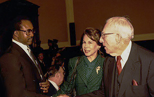 Photo of former NFL player Larry Brown, Geraldine Fox, and Congressman Pepper.