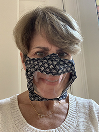 NIDCD Director Debara Tucci wearing a clear face mask.