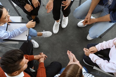 Overhead view of a group of people having a discussion.