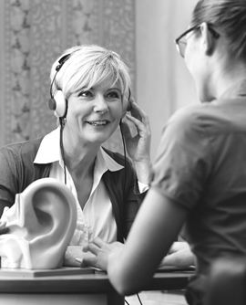 Woman wearing headphones.