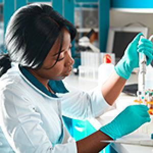 A postbaccalaureate student working in a lab.
