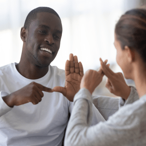 two people in conversation using american sign language
