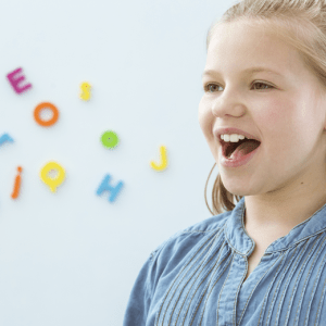 young girl practicing speaking